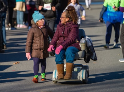 GOTR participant pictured with running buddy in wheelchair.