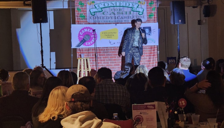 Photo of comedian Amy Tee performing at Girls on the Run Worcester County's 1st annual Comedy Night Fundraiser!